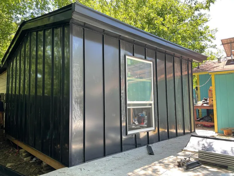 Black standing seam metal wall panels for Roof Inspection in Colorado Springs