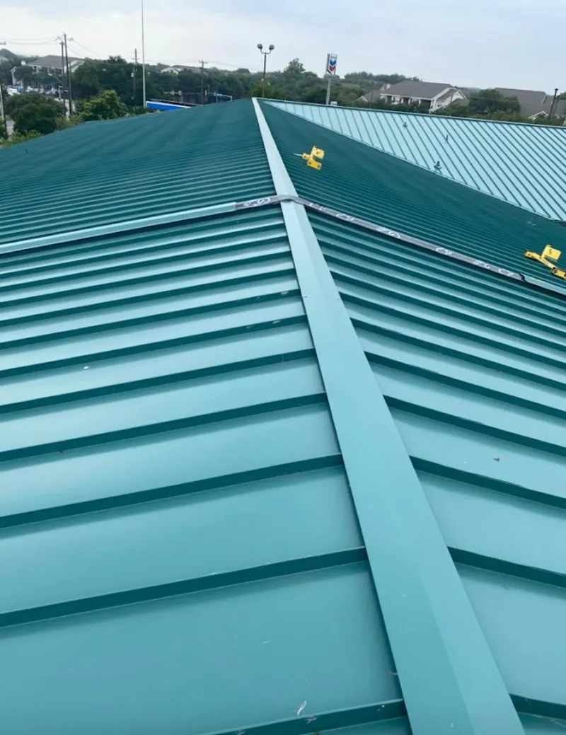 Green commercial metal roof ridge and valley for Metal Roof Repair in Colorado Springs