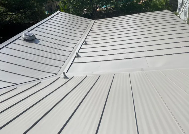 Solar attic fan installed on a metal roof for Roof Ventilation in Colorado Springs